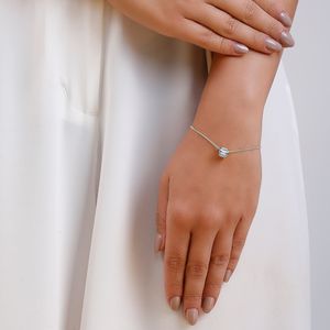 Pulseira com pingente entremeio